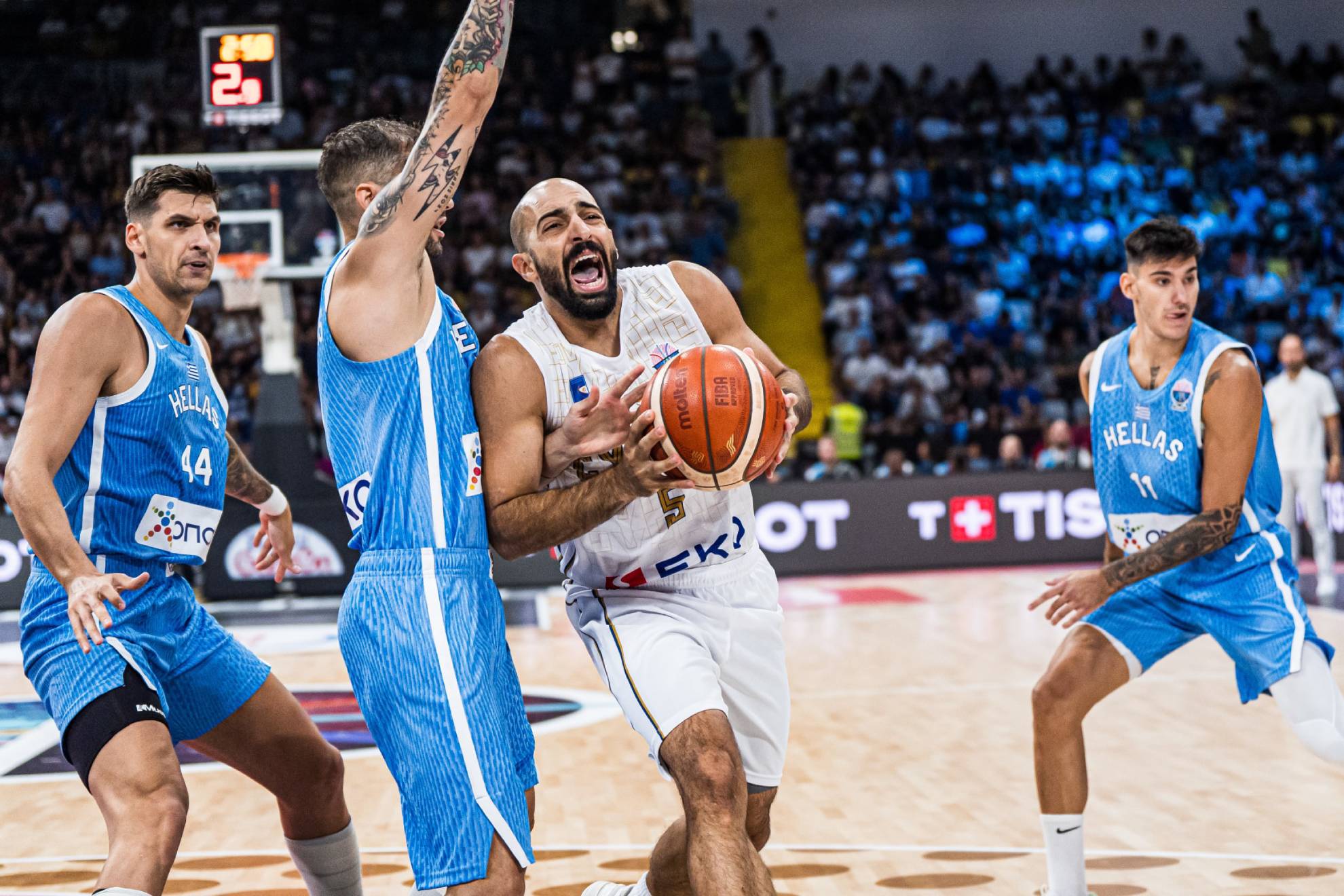 Simon Michall makes an entrance to the basket in the match against Greece.